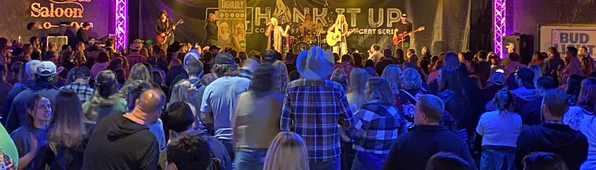 country concert with fans wearing cowboy hats Lancaster