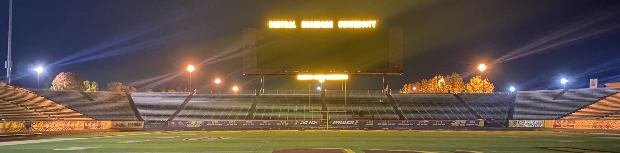 empty football stadium at night under the lights Lancaster